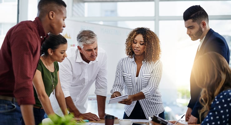 An HR business partner talking with her employees.