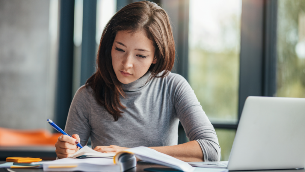 Female college graduate studying to take the GMAT exam
